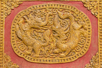 Singha Wall sculpture on Ubosot in Wat Saen Fang , Chiangmai Tha