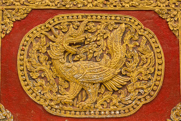 Naga Fusion Swan Wall sculpture on Ubosot in Wat Saen Fang , Chi