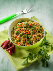oat with peas carrots and hot chili pepper, selective focus