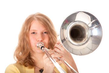 closeup of young woman in yellow with trombone © ahavelaar