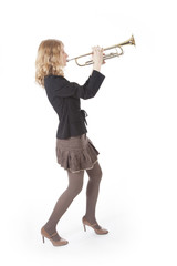 young pretty woman playing the trumpet