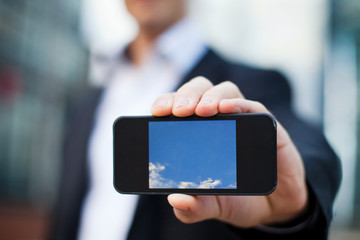 smartphone in the hand of businessman