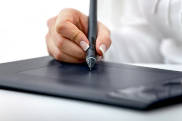 digital graphics tablet and a hand