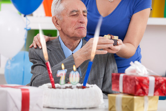 senior man celebrating 70th birthday