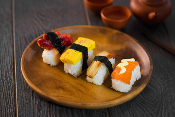 Sushi Assortment On wooden Dish, close up