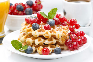 delicious breakfast with Belgian waffles and berries, close-up