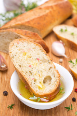 piece of baguette in a fragrant olive oil, spices and garlic