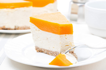 piece of cheesecake with pumpkin jelly on the plate