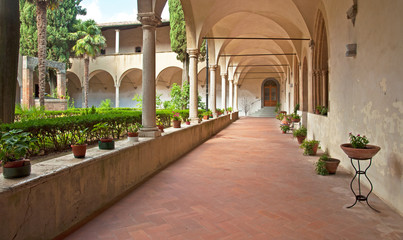 Cloister with flowers in Italy