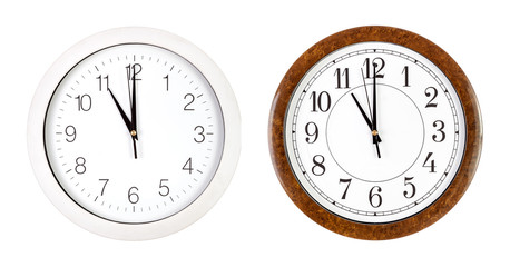 Two clock faces showing eleven o'clock