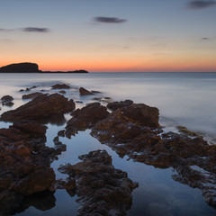 Fototapeta na wymiar Stunning landscapedawn sunrise with rocky coastline and long exp