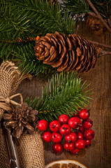 Vintage silverware on rustic wooden background with christmas de