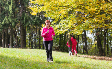 Fototapeta premium woman running in the forest