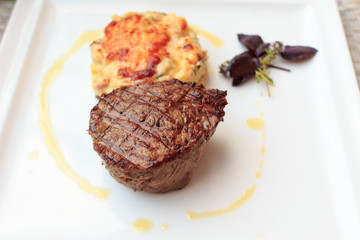 Steak with gratin on a plate