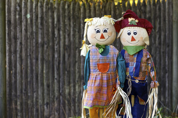 Two scarecrows in garden