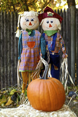 Two happy scarecrows in garden
