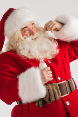 Fototapeta premium Santa Claus drinking milk from bottle