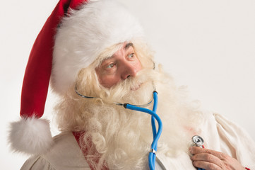 Santa Claus Doctor using a stethoscope on himself