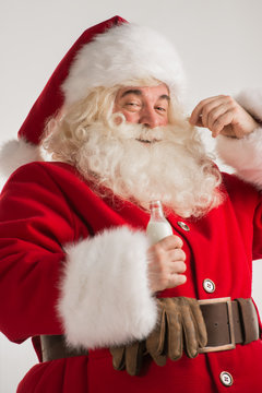 Santa Claus drinking milk from bottle