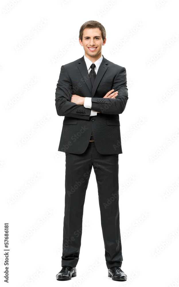 Wall mural Full-length portrait of business man with hands crossed