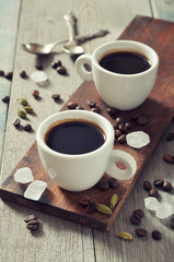 Coffee in cups with spices
