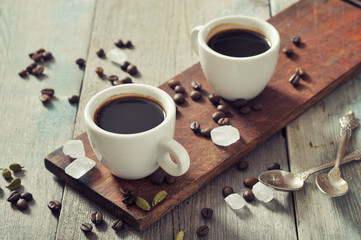 Coffee in cups with cardamom