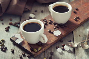 Coffee in cups with cardamom