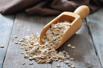 oat flakes in wooden  scoop