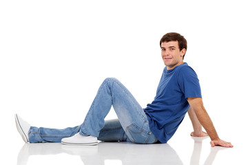 relaxed man sitting on the floor