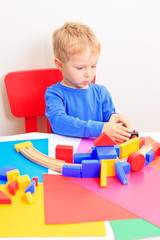 little boy playing with toys, early education