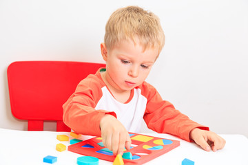 little boy learning shapes, early education