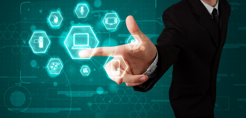 Businessman pressing virtual media type of buttons