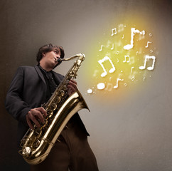 Handsome musician playing on saxophone with musical notes