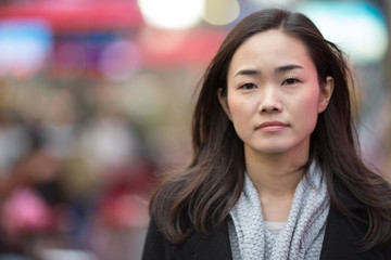 Asian woman in New York City sad face