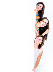 girls peeking from behind a blank