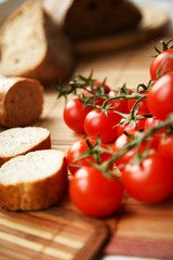 Fototapeta na wymiar Bread and tomatoes on the kitchen table