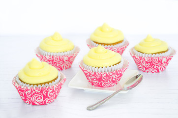 Several cupcakes on white background, selective focus