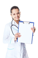 young smiling female doctor showing blank clipboard