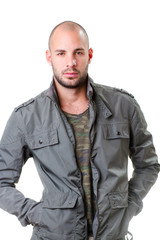 young man portrait, he wearing army t-shirt and grey jacket