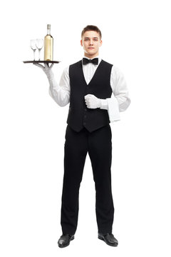 Young Waiter With Bottle Of Wine On Tray