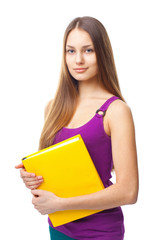 Fototapeta premium young student girl holding yellow book
