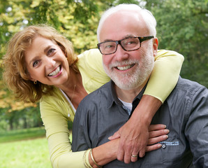 Portrait of a happy senior couple smiling outdoors