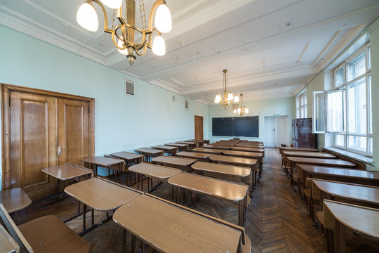 Classroom with tables and chandeliers