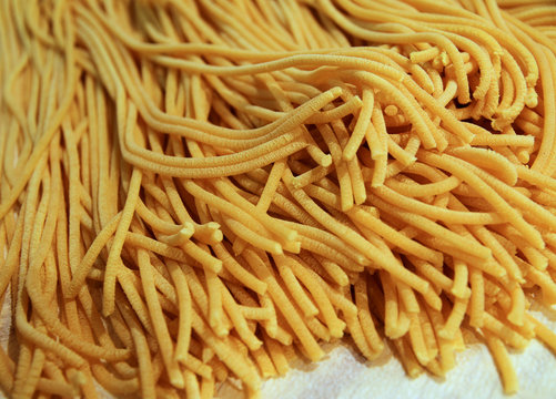 bigoli al torcio made with flour and eggs in a home-style cookin