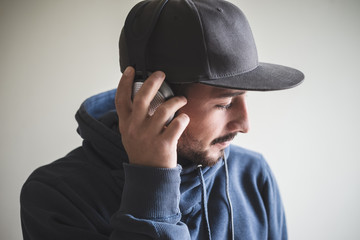 young stylish man listening to music