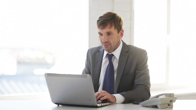 businessman with laptop computer and phone