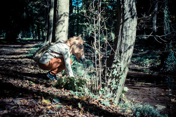 young hipster horse mask woman in autumn