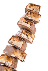 pile of chocolate bars isolated on white