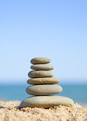 Fototapeta na wymiar stack of zen stones near the ocean