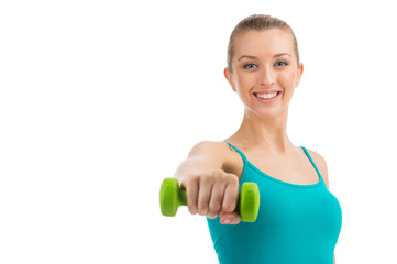 Nice smiling woman exercising with dumbbells.